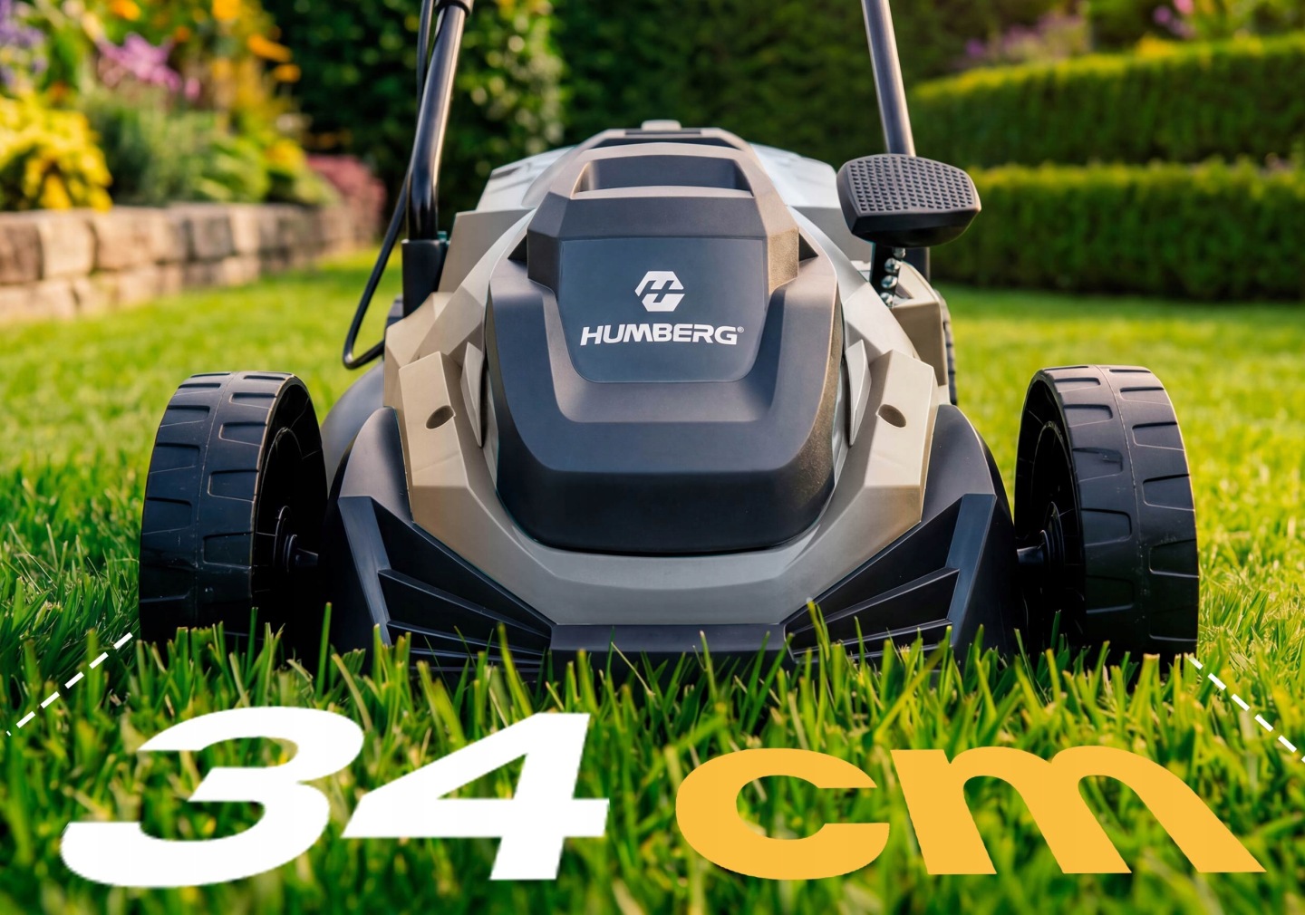 Humberg HM-612 zāles pļāvēja priekšējais skats uz zāliena ar 34 cm pļaušanas platuma norādi